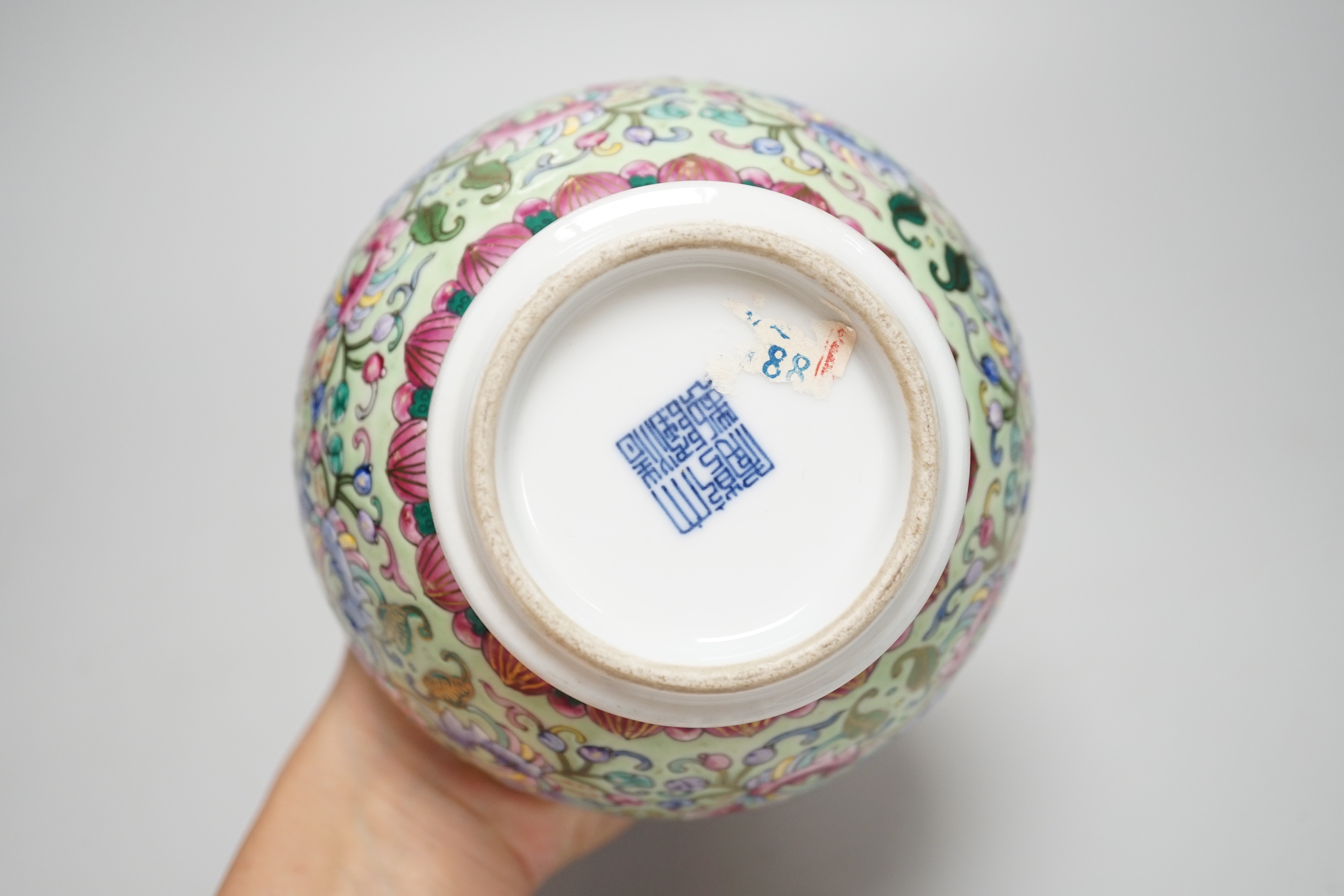 A Chinese enamelled porcelain celadon ground vase, 23.5cm
